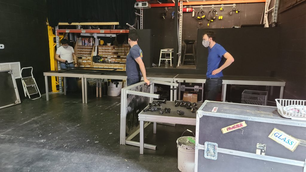 volunteers stand in the theatre