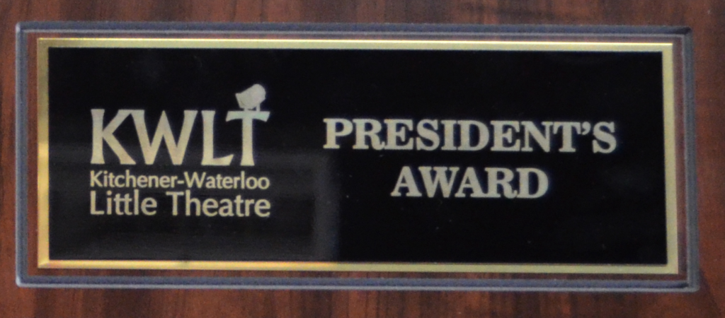 The top of the President's Award plaque, featuring the KWLT logo